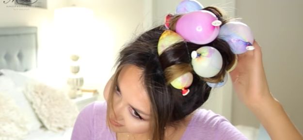 This woman slept with balloons in her hair and you won't believe why!