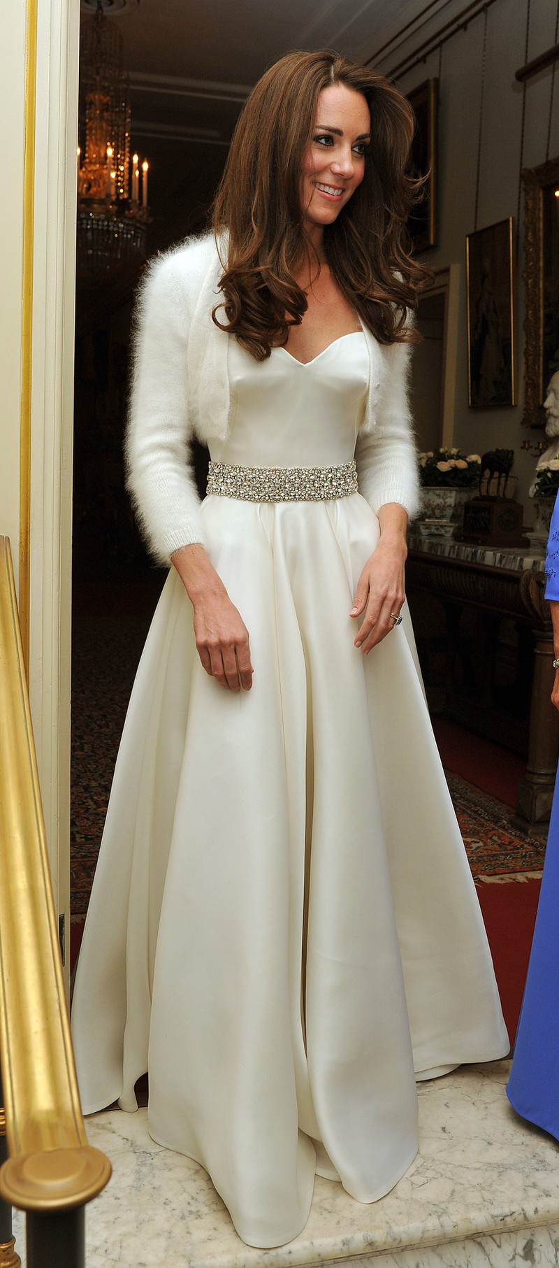 Princess Kate wore a stunning, silk dress to her wedding celebration, paired with a soft short cardigan.