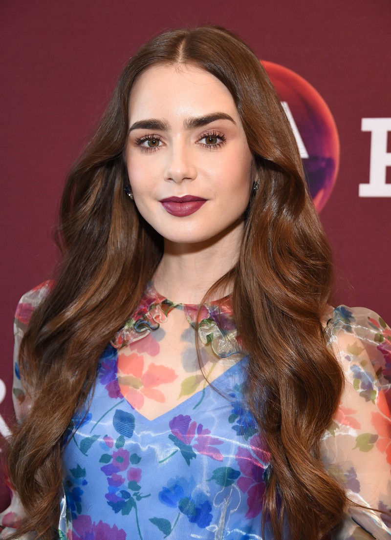 Lily Collins shows us how to wear bold lips.