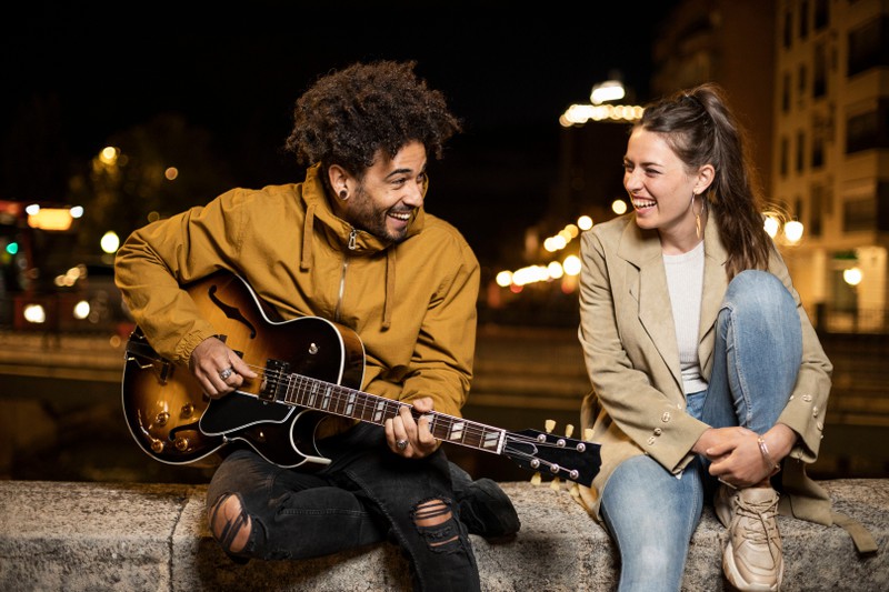 A couple is making music together because they love it and each other.