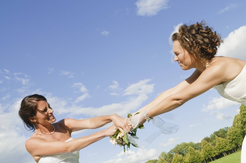 The bride is jealous of her pretty bridesmaid.