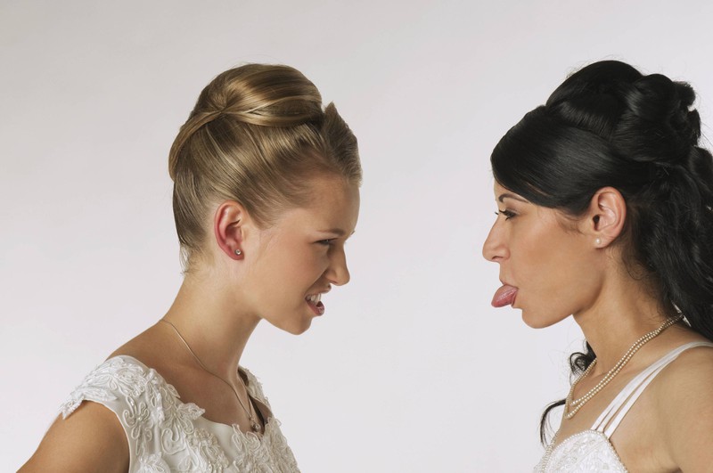 Two brides fighting over a dress.