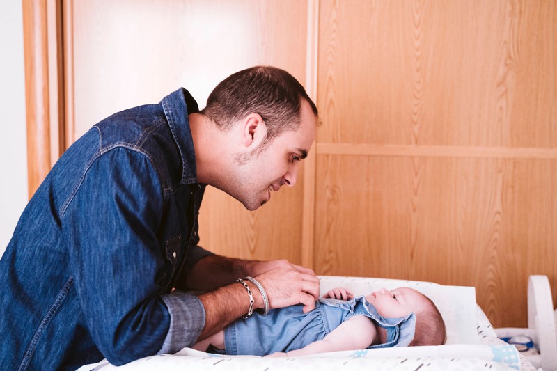 A dad and his daughter after she had her first bath.