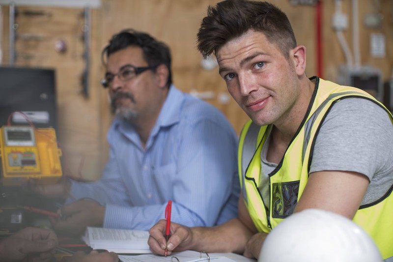 An electrician feeling confident about not being fired.