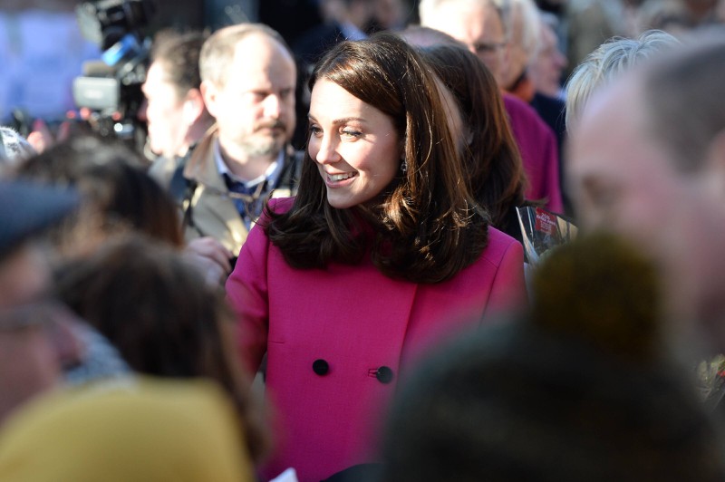 Kate wears a pink coat while visiting Coventry Cathedral.