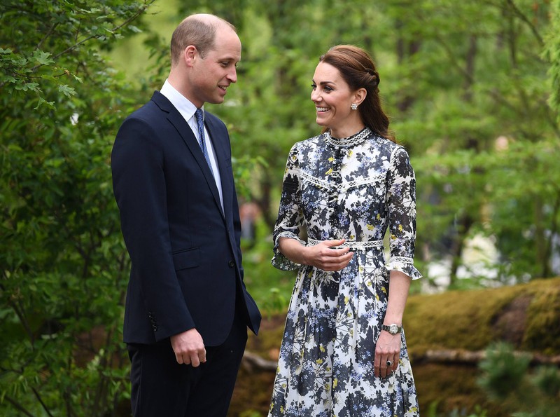 Duchess Kate smiles at Prince Philip who isn't wearing his wedding ring.