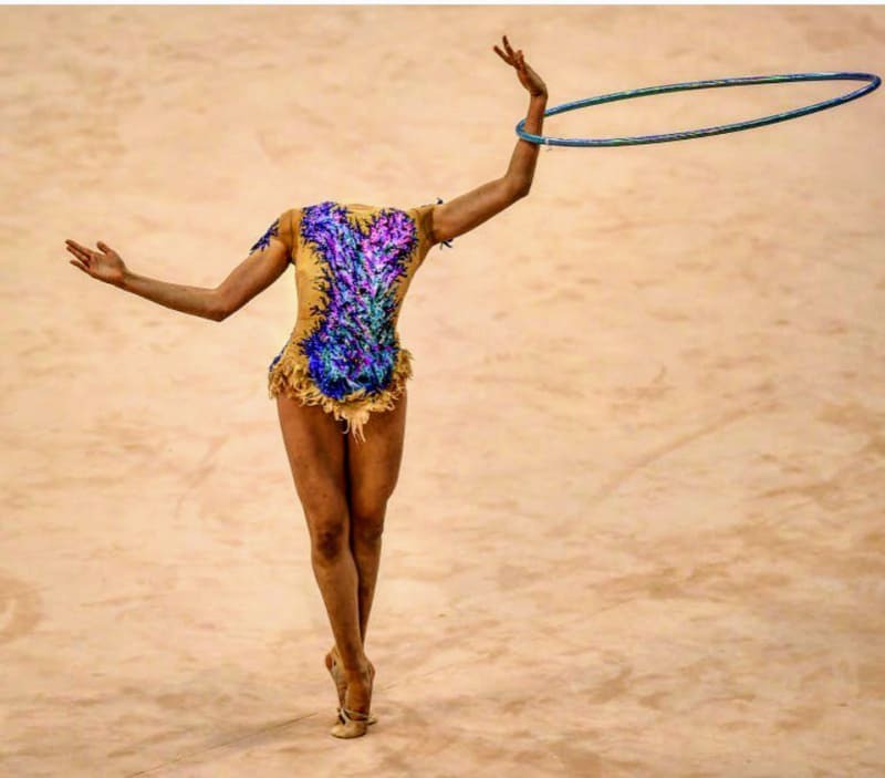 A gymnast with hoola hoops