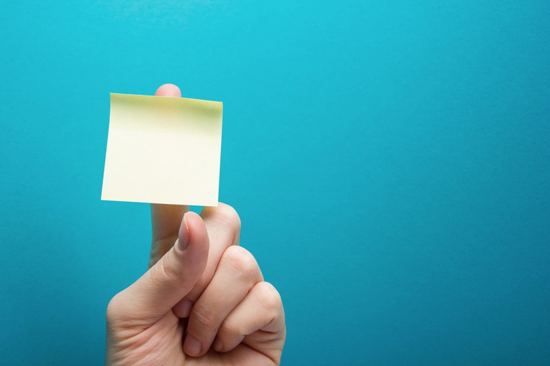 If you tear the Post-it notes from the side, they stay flat longer.