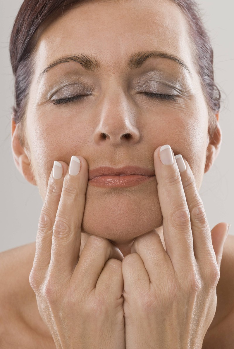 A woman suffers from torn corners of her mouth