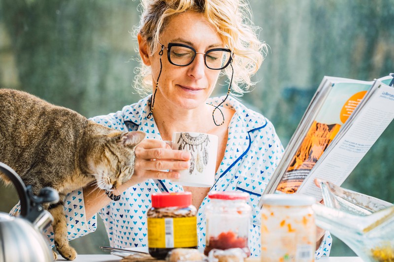 The cat shows that he loves the woman.