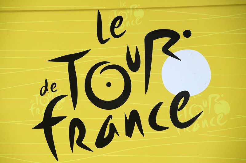 A cyclist hides in the logo of the Tour de France