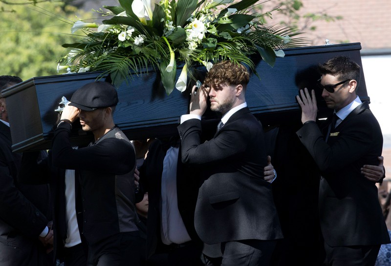 The Wanted band members carry the coffin of Tom Parker at his funeral at St.Francis of Assisi Church in Petts Wood, London.