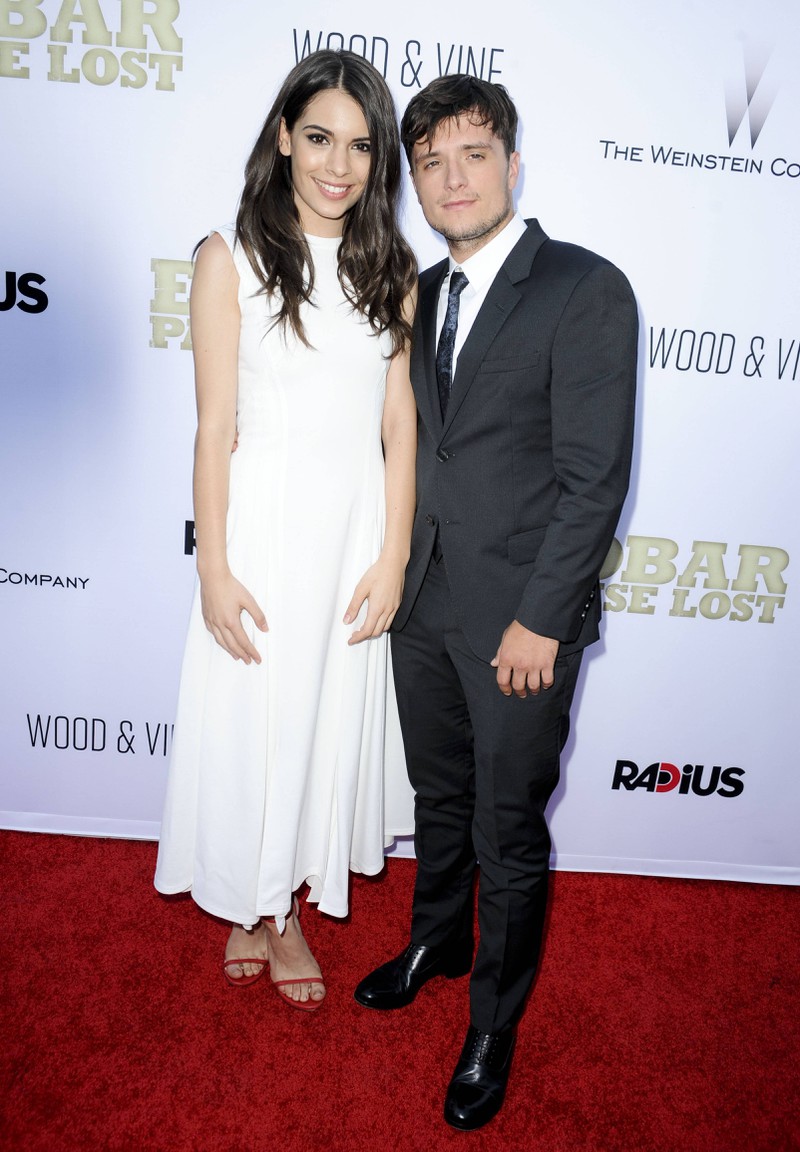 Josh Hutcherson and his partner Claudia Traisac stand at a similar height.