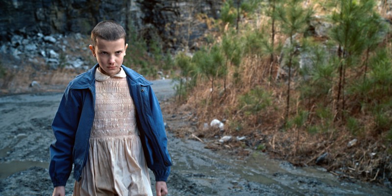 The picture shows the actress of the role "Eleven", which is an important character in "Stranger Things"