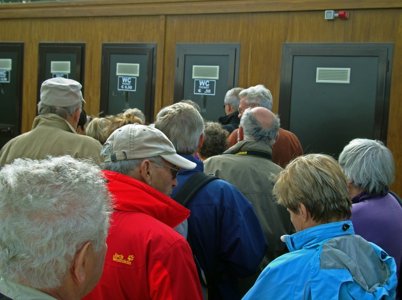 Waiting times are usually shorter when bathroom stalls have gaps.