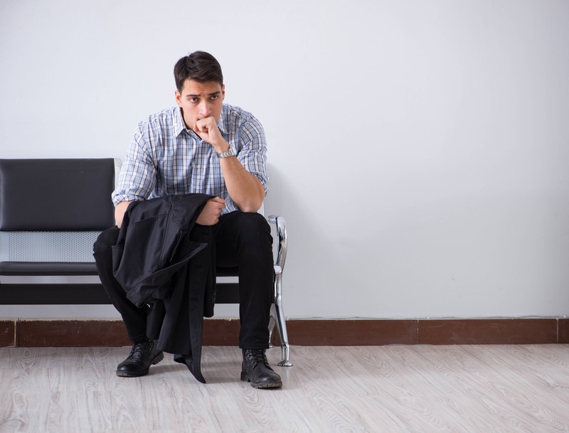 Man nervously impatiently waiting in the lobby