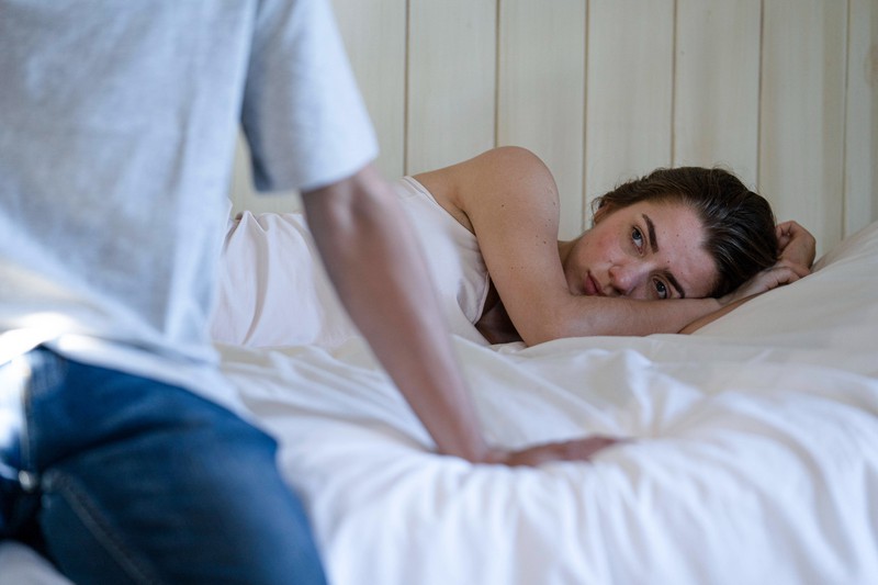 Young couple having relationship difficulties in the bedroom