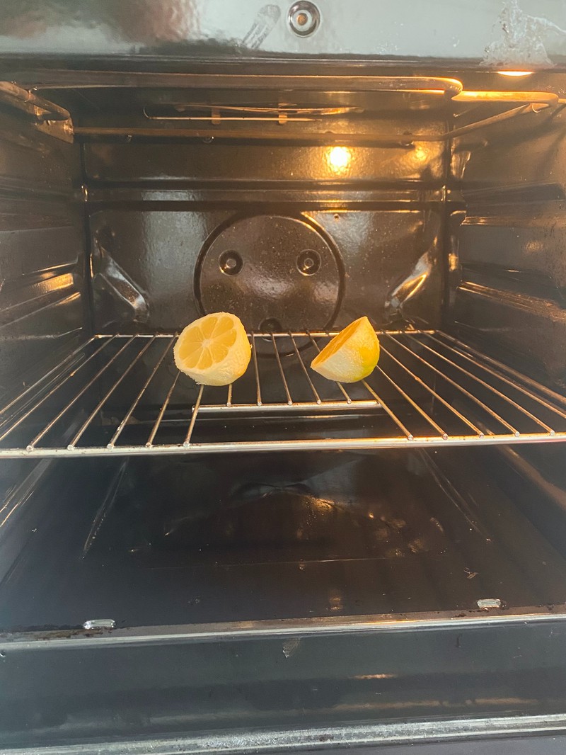 A photo of a lemon in the oven, which can help clean the oven