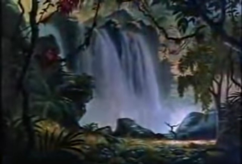 The backdrop of a waterfall in the jungle